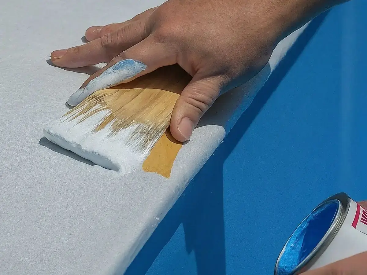 Applying primer to the pool 